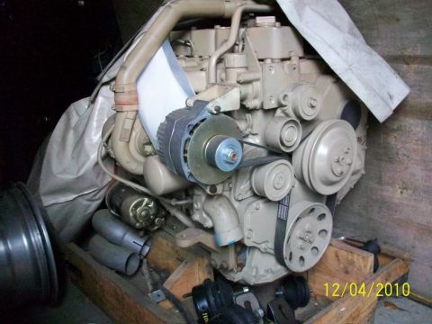 1986 Jeep Wagoneer - Engine components are visible, including the alternator and drive belts.