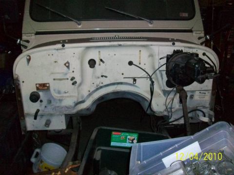 1986 Jeep Wagoneer - The firewall of a Jeep vehicle is shown with components removed, revealing the internal structure.