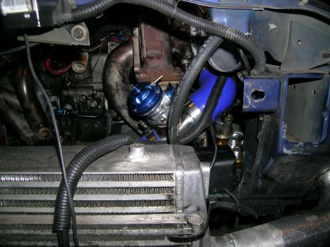 1995 Ford Probe - Custom turbocharger setup with a blue blow-off valve and intercooler visible.