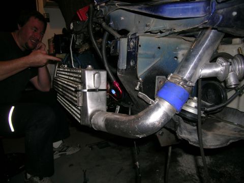 1995 Ford Probe - Custom intercooler piping and turbocharger components are being installed.