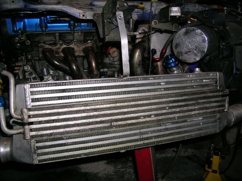1995 Ford Probe - Close-up of a modified engine showing an intercooler and turbo components.