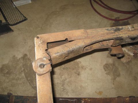 1963 Ford Galaxie - This heavily rusted metal component appears to be a section of a vehicle's frame or suspension system.