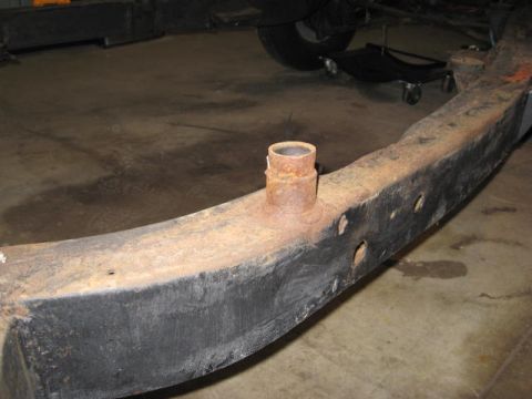 1963 Ford Galaxie - A close-up view of a heavily rusted vehicle frame section, a protruding pipe fitting. The Supermotors.net logo is visible in the lower righ…