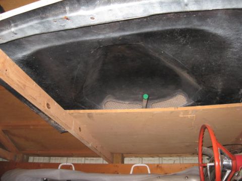 1963 Ford Galaxie - A view from underneath the hood of a vehicle, showing insulation and a glimpse of the interior.