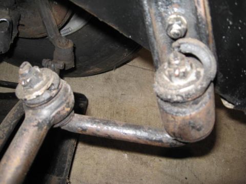 1963 Ford Galaxie - Close-up view of worn suspension parts, including ball joints and tie rod ends, suggesting a need for restoration.