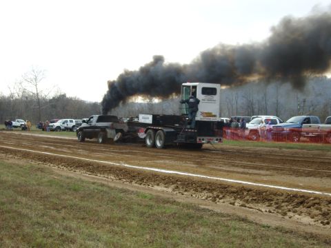 2007 Ford Mustang - Truck and trailer in a pull event, generating significant exhaust smoke.
