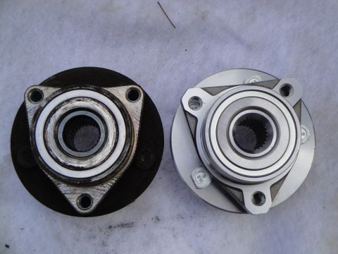 2003 Ford Taurus - A comparison of a used wheel hub bearing next to a new one.