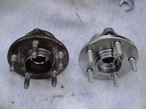 2003 Ford Taurus - Comparison of a used and a new front wheel hub assembly.