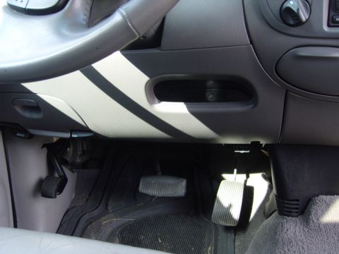 2007 Ford Mustang - Interior view of a vehicle's driver side, focusing on the pedals and steering column area.