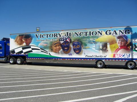 2007 Ford Mustang - A tractor-trailer displays a mural for Victory Junction Gang, a proud charity of NASCAR.