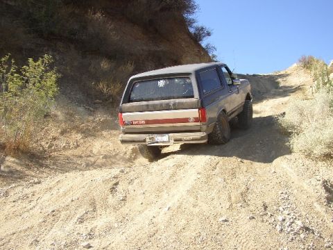1989 Ford Bronco - This 1989 Ford Bronco navigates a steep, dusty trail on a clear day.