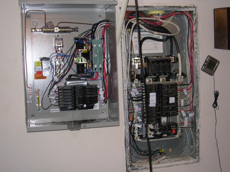 I added the breaker tray (from a panel I bought separately) to the generator switch box, and moved the original breakers & their wires from the house box.  That's why there are so many empty spaces on the right.