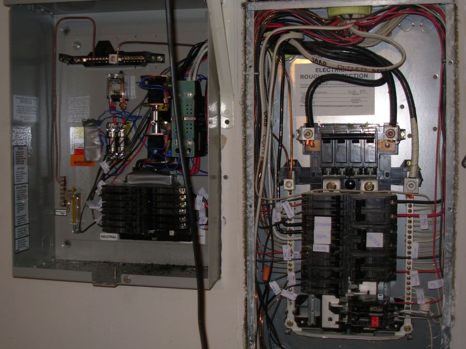 I added the breaker tray (from a panel I bought separately) to the generator switch box, and moved the original breakers & their wires from the house box.  That's why there are so many empty spaces on the right.
