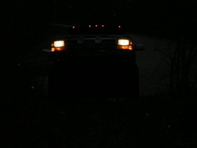 truck with headlights on at night