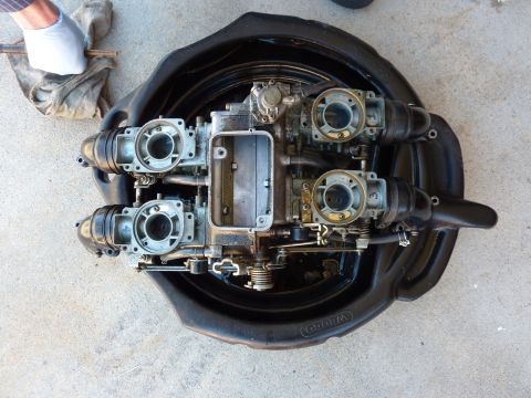 1978 Honda GL1000 - Disassembled motorcycle carburetors are shown in a black drain pan, ready for cleaning or rebuilding.