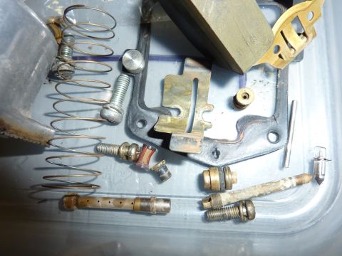 1978 Honda GL1000 - Disassembled carburetor parts laid out for cleaning or repair.