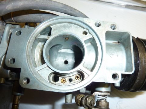 1978 Honda GL1000 - Close-up view of a disassembled carburetor, revealing internal mechanisms and metal construction.