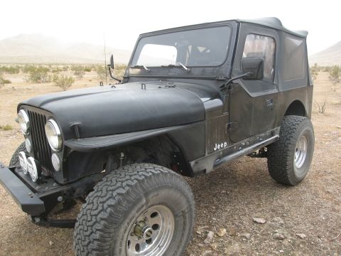 1986 Ford Bronco - This Jeep CJ-7 has a distinctive body style and grille, indicating it's from the 1976-1986 model range.