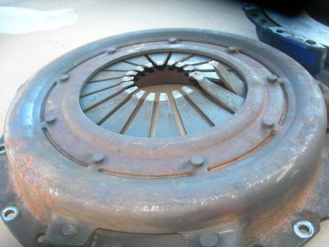1984 Ford Bronco - A worn clutch pressure plate shows signs of damage to its diaphragm springs.