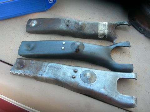 1984 Ford Bronco - Three clutch fork parts are shown, one with a partial sticker and 'MADE IN U.S.A.' visible on another.