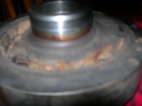 1984 Ford Bronco - A close-up view of a pulley with visible rust and wear.