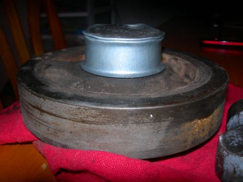 1984 Ford Bronco - Close-up of a pulley and hub assembly, likely a vehicle part.