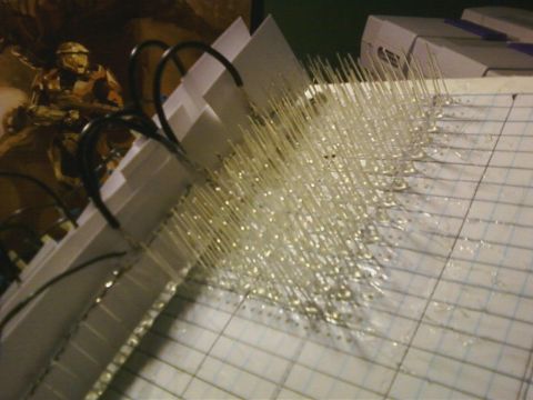 1990 Ford Bronco - Close-up of numerous LEDs with attached wires, organized on grid paper.