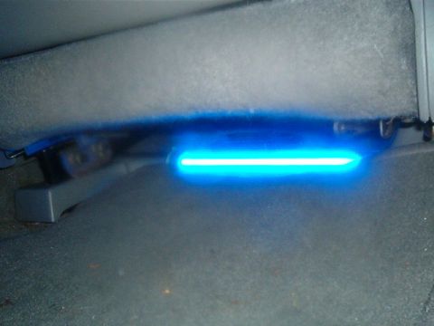 1998 Ford Taurus - A blue LED light strip is installed under the seat of a vehicle.
