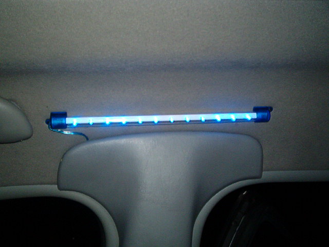 Blue LED light bar mounted on car's headliner