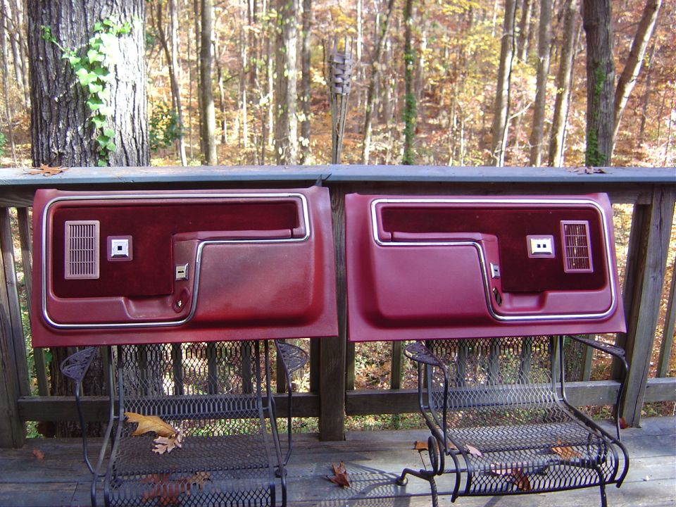 The restored drivers side door panel next to the non restored passenger side panel.