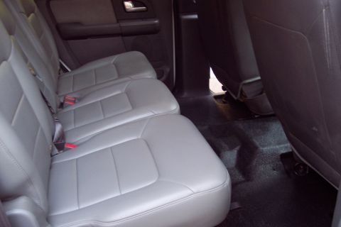 2001 Ford Crown Victoria - Interior view of gray leather rear seats in a vehicle.