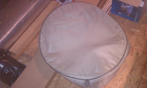 1996 Ford Bronco - A tan spare tire cover with embroidered text is shown, likely for a vehicle.