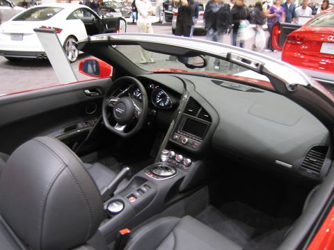 1991 Ford LTD Crown Victoria - Interior view of a red convertible sports car, showing the dashboard, steering wheel, and seats.