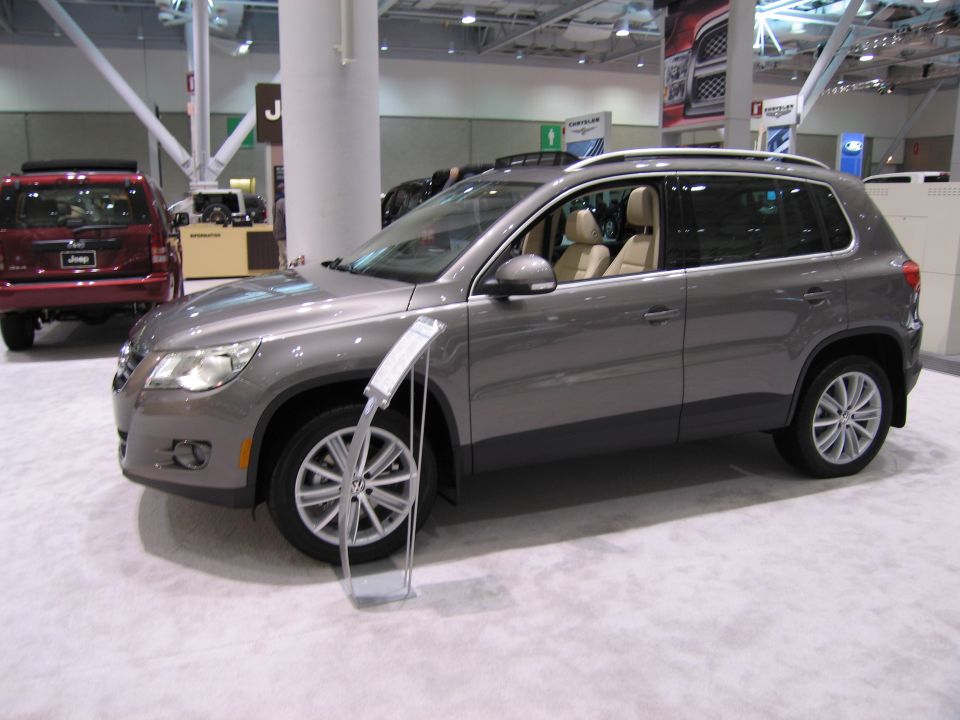 Gray SUV with tan interior, seen from the front 3/4 angle