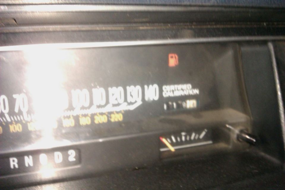 Dashboard gauges showing 140 mph speedometer, fuel gauge, and certified calibration
