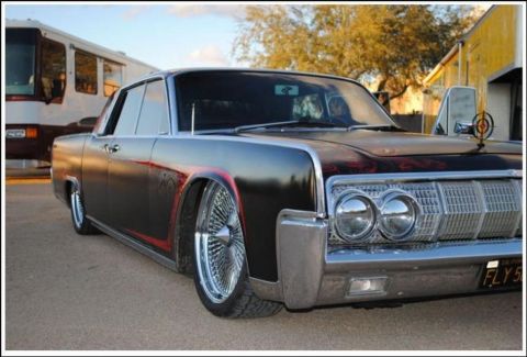 1991 Ford LTD Crown Victoria - This customized Lincoln Continental features a distinctive grille and wire wheels.