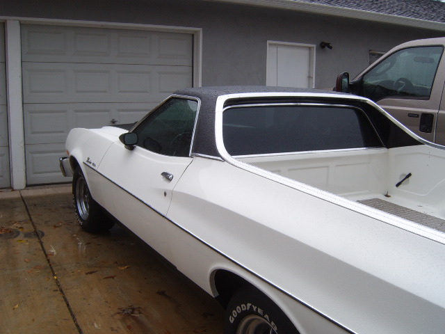 White 1973 Ford Ranchero with black vinyl top, 3/4 front view