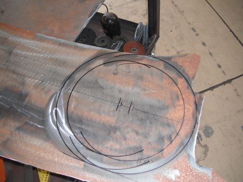 1986 Ford Bronco - Metal sheet marked with circles and lines, likely for fabrication or repair work.