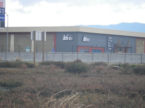 1991 Ford Bronco - Exterior view of an REI store, listing various outdoor activities.