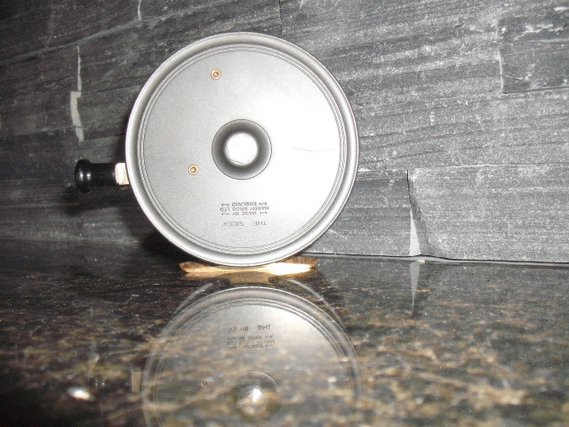 Metal lid with a black handle, text on the lid reads 'THE SPEAR' and 'MADE BY HARDY BROS. LTD ENGLAND'