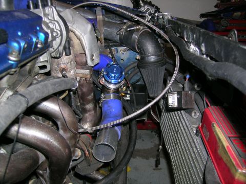 1995 Ford Probe - Custom turbocharger setup with blue blow-off valve and intercooler piping visible in the engine bay.