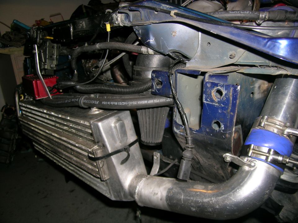 intercooler, intake piping, and engine bay structure