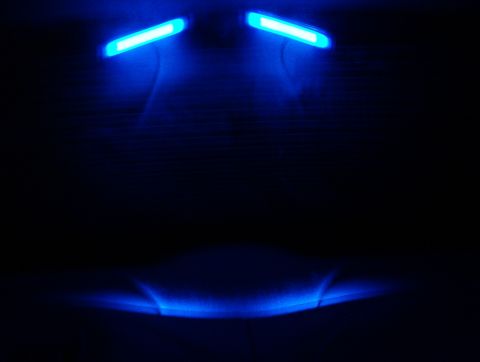 1998 Ford Taurus - Interior car lights glow blue in the dark, with a website watermark visible.