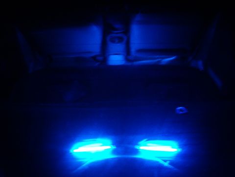 1998 Ford Taurus - Interior of a car with blue LED lights illuminating the footwell and rear seats.