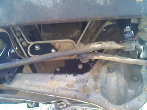 1995 Ford F-150 - Close-up of truck's underbody showing suspension and steering components.
