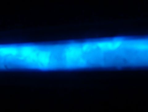 1998 Ford Taurus - A horizontal blue light strip is visible against a black background, with website text in the lower right corner.