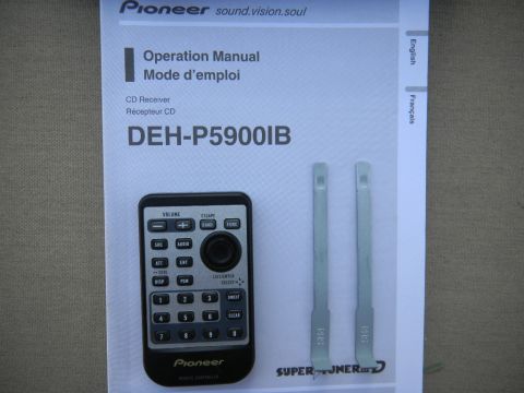 1997 Ford Ranger - Operation manual and remote for a Pioneer DEH-P5900IB CD receiver are shown with installation tools.
