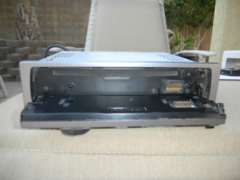 1997 Ford Ranger - Car stereo with open faceplate showing connectors and a Pioneer logo.