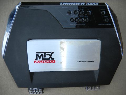 1997 Ford Ranger - This is an MTX Audio 4-channel amplifier, model Thunder 3404, with multiple adjustment knobs and input/output terminals.