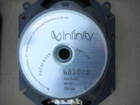 1997 Ford Ranger - Back of an Infinity Reference Series 6810cs car audio speaker, showing the brushed silver magnet cover printed with the Infinity logo, mode…